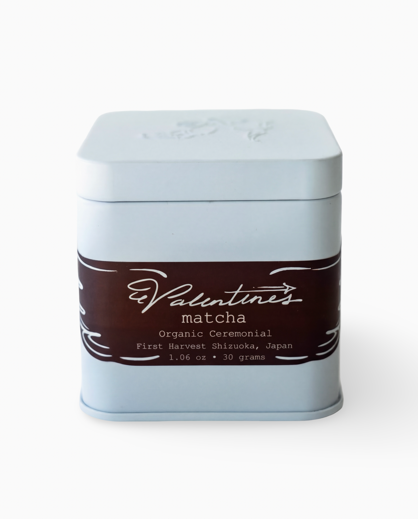 Ceremonial matcha in blue square tin with brown label on white background